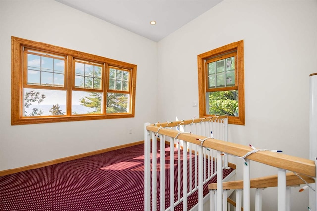 hallway featuring recessed lighting, baseboards, and carpet flooring