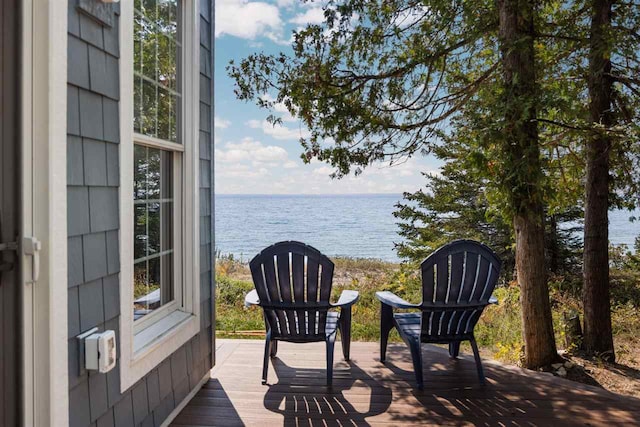 wooden terrace with a water view