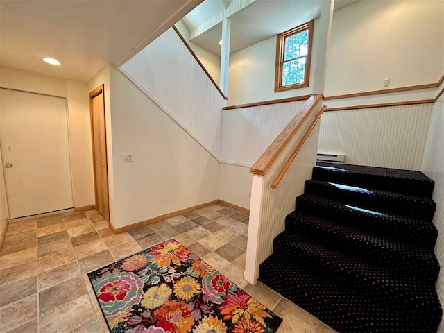 entryway with light tile patterned flooring