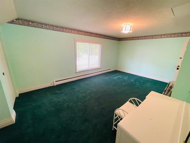 spare room with a textured ceiling, baseboard heating, dark colored carpet, and lofted ceiling