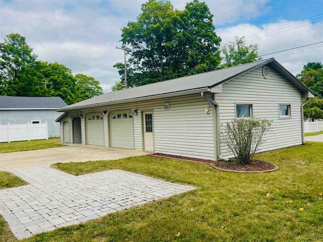 garage with a yard