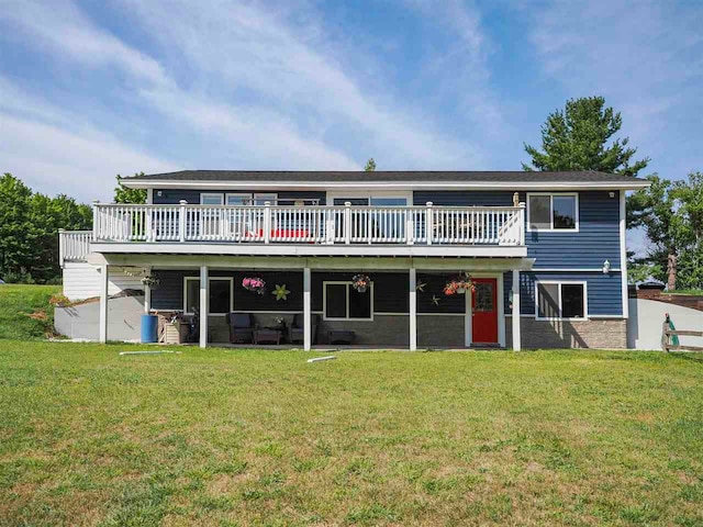 rear view of house with a lawn