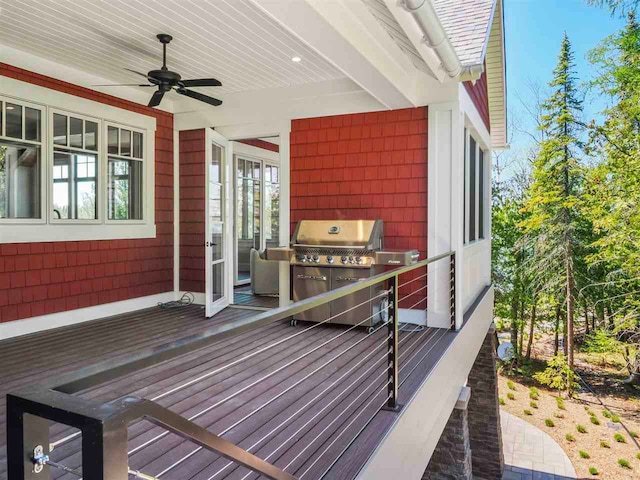 11305 Evergreen Ln, Charlevoix, MI 49720 - wooden terrace featuring a ceiling fan and a grill