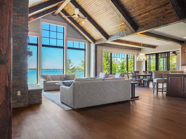 11305 Evergreen Ln, Charlevoix, MI 49720 - living area with a chandelier, dark wood finished floors, wood ceiling with exposed beams, high vaulted ceiling, and a water view