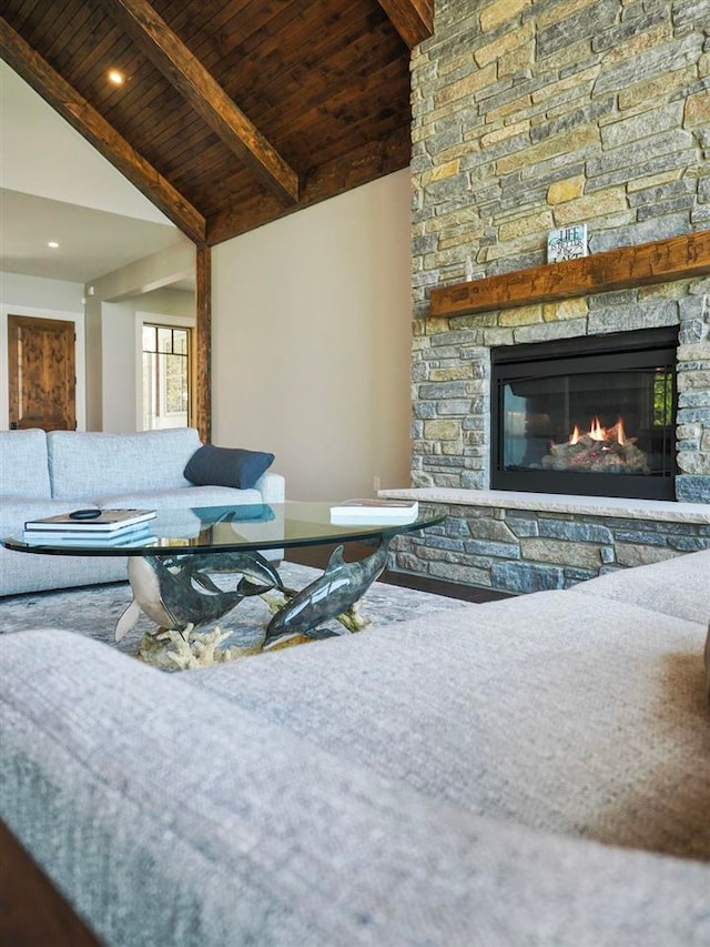 11305 Evergreen Ln, Charlevoix, MI 49720 - living room with wooden ceiling with exposed beams, a fireplace, and high vaulted ceiling