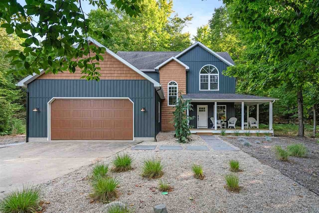 view of front of property with a garage and covered porch