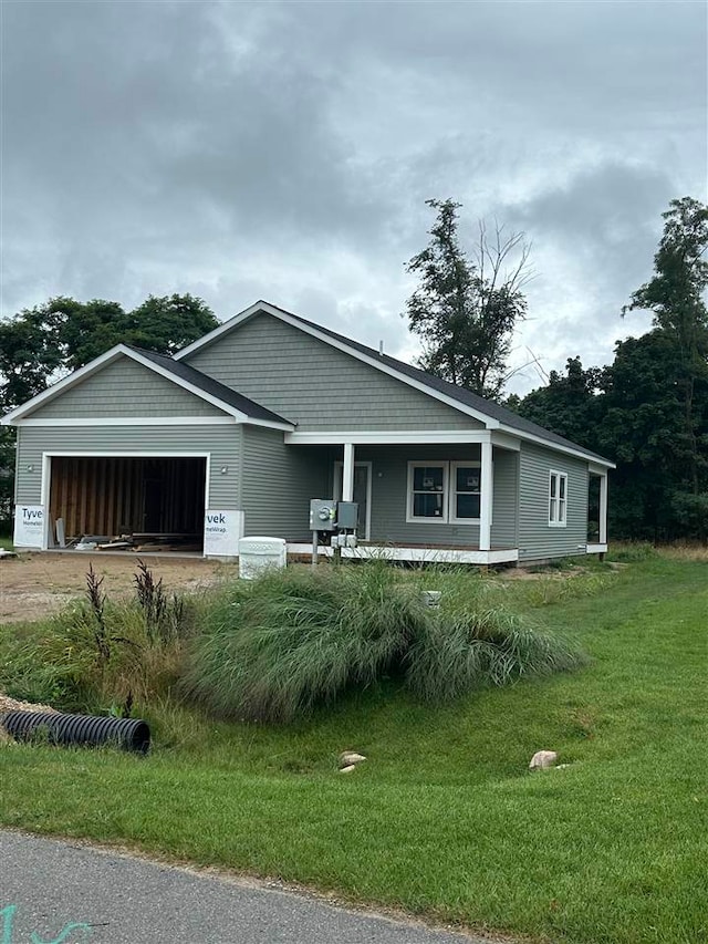 view of front of home featuring a porch and a garage