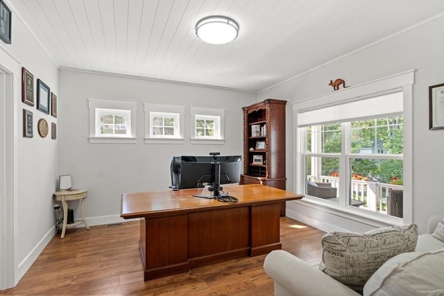 office space featuring wooden ceiling, baseboards, and light wood finished floors