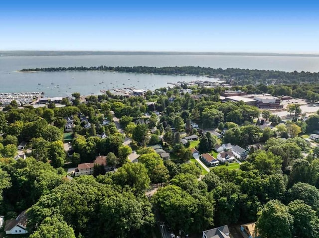 birds eye view of property with a water view and a residential view