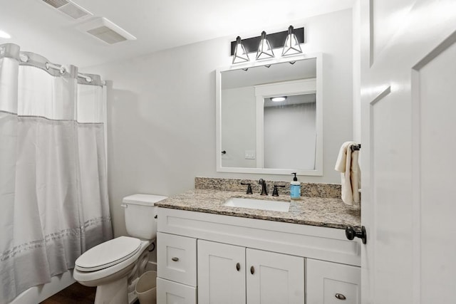 bathroom with toilet, visible vents, shower / bath combo with shower curtain, and vanity