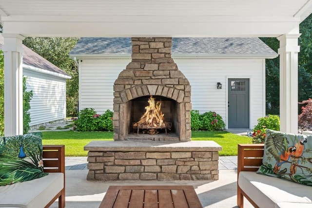 view of patio with an outdoor stone fireplace