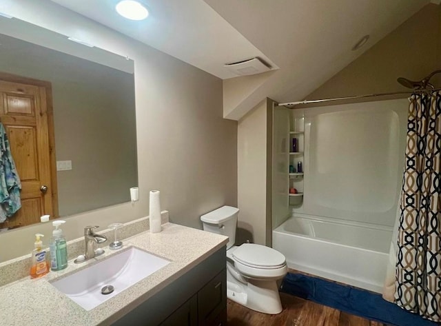 full bathroom with vanity, toilet, wood-type flooring, and shower / bath combo