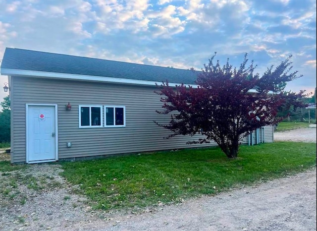 view of property exterior with a yard