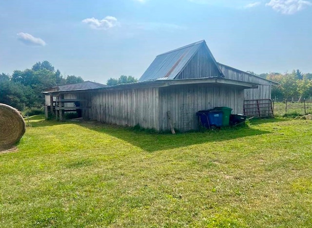 view of side of property with a lawn