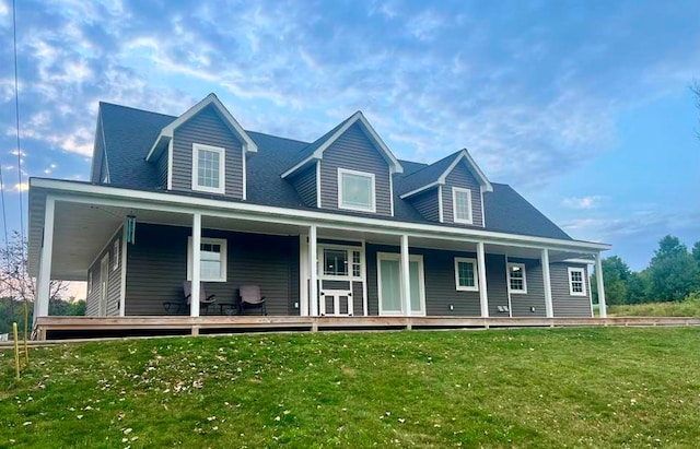 view of front of house with covered porch and a front yard