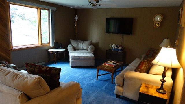 living room with ceiling fan, plenty of natural light, a baseboard radiator, and carpet floors