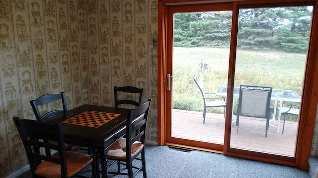 dining space featuring carpet flooring