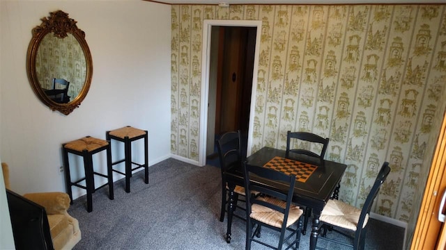 2767 Lake Grove, Petoskey, MI 49770 - dining space featuring dark carpet, baseboards, and wallpapered walls