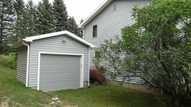 garage with a lawn