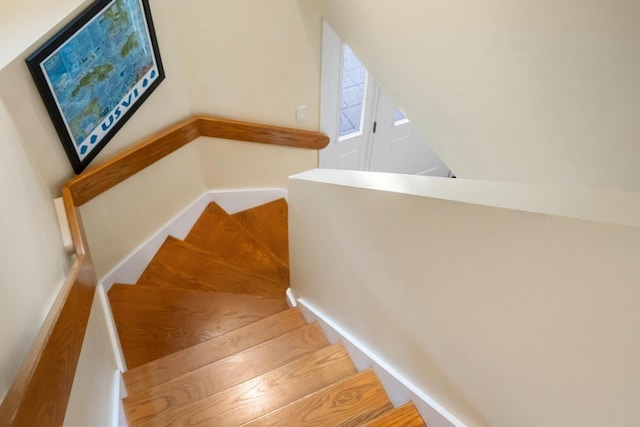 645 Woodhill Ct, Harbor Springs, MI 49740 - stairs featuring baseboards