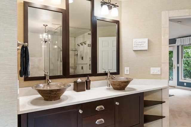 645 Woodhill Ct, Harbor Springs, MI 49740 - full bath with double vanity, a shower stall, and a sink