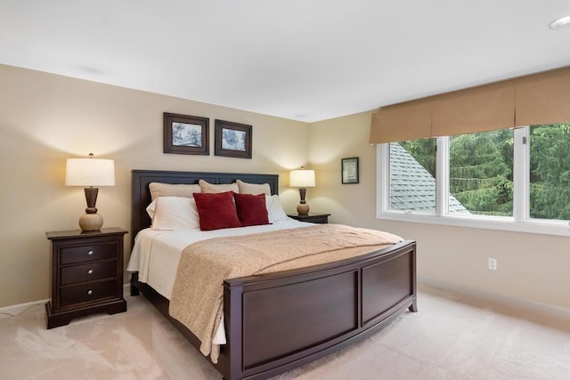 645 Woodhill Ct, Harbor Springs, MI 49740 - bedroom with baseboards and light carpet