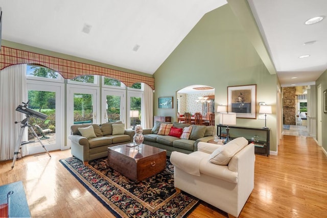 645 Woodhill Ct, Harbor Springs, MI 49740 - living room with plenty of natural light, high vaulted ceiling, and light wood-style floors