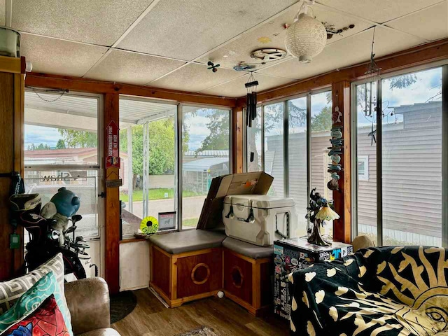 sunroom / solarium featuring a paneled ceiling