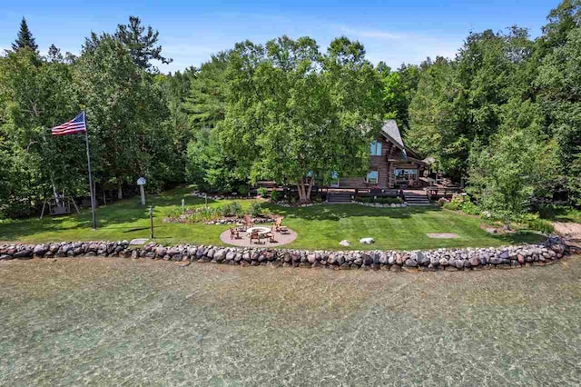 exterior space featuring a lawn and a deck