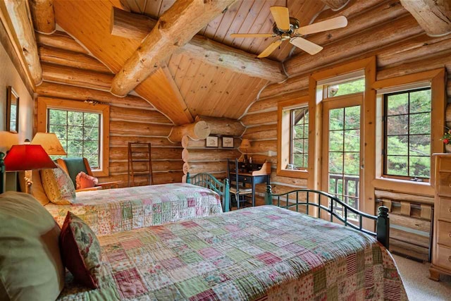 carpeted bedroom with ceiling fan, beam ceiling, log walls, and wooden ceiling