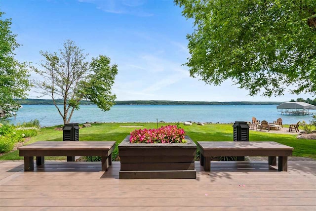 exterior space featuring a water view and a yard