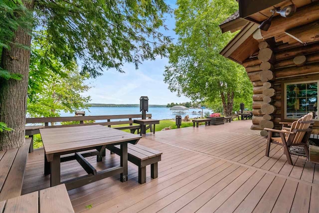 wooden deck featuring a water view