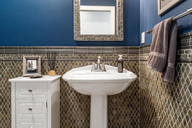 bathroom with tile walls