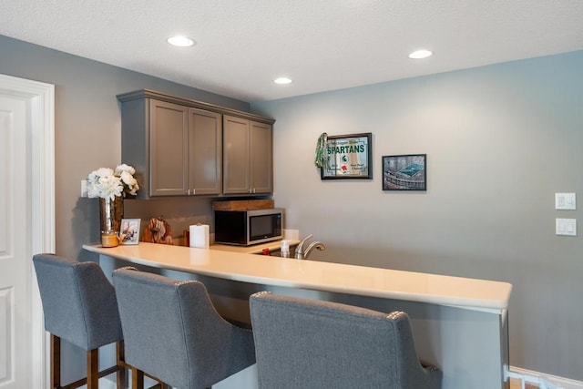 bar featuring gray cabinets