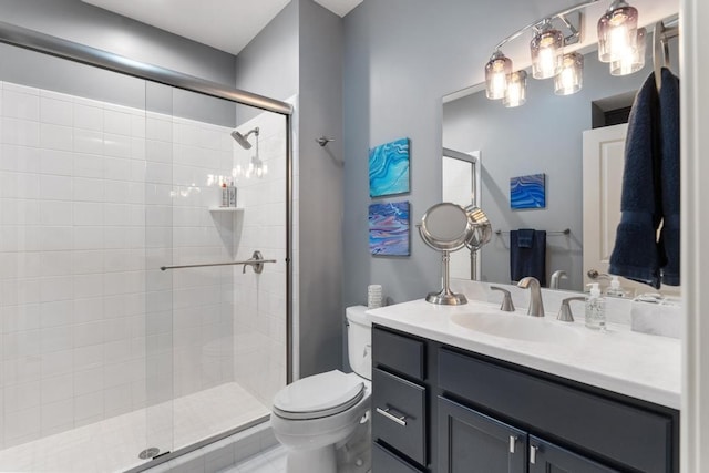 bathroom with vanity, toilet, and walk in shower