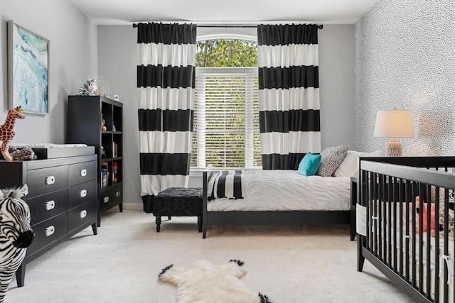 bedroom with light colored carpet