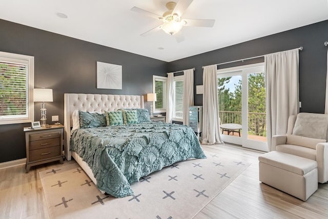 bedroom featuring access to outside, ceiling fan, and hardwood / wood-style flooring