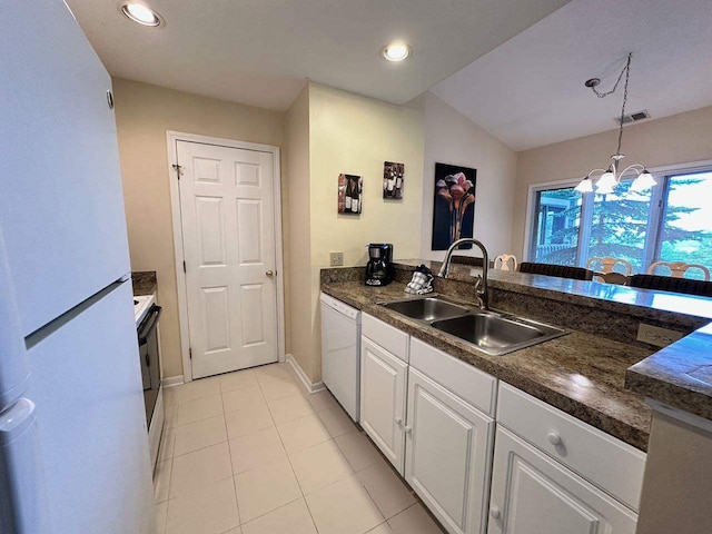 kitchen with white cabinets, hanging light fixtures, an inviting chandelier, white appliances, and sink