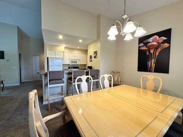 carpeted dining area featuring a notable chandelier