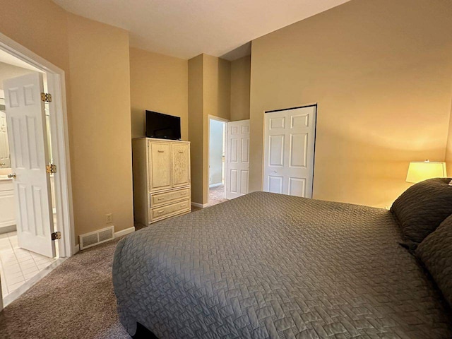 bedroom featuring light colored carpet