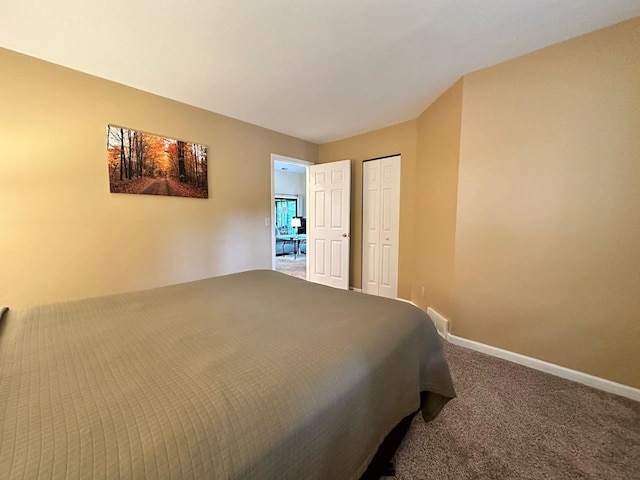 carpeted bedroom with a closet