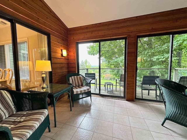 sunroom featuring lofted ceiling