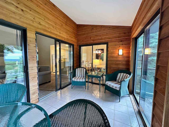 sunroom / solarium featuring lofted ceiling