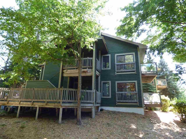 back of house featuring a deck