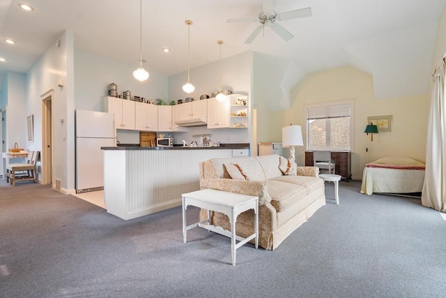 living area with a ceiling fan, vaulted ceiling, recessed lighting, and light colored carpet