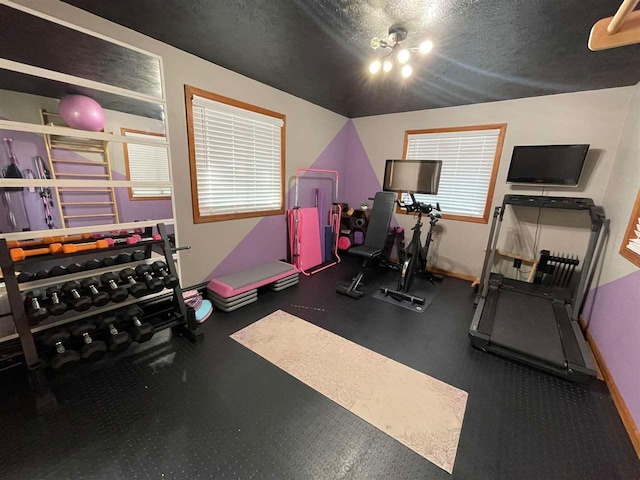 exercise area with a textured ceiling