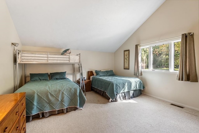 bedroom featuring carpet and vaulted ceiling