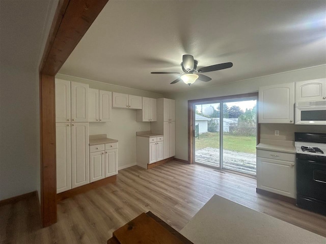 kitchen with ceiling fan, white cabinets, beam ceiling, white appliances, and light hardwood / wood-style floors