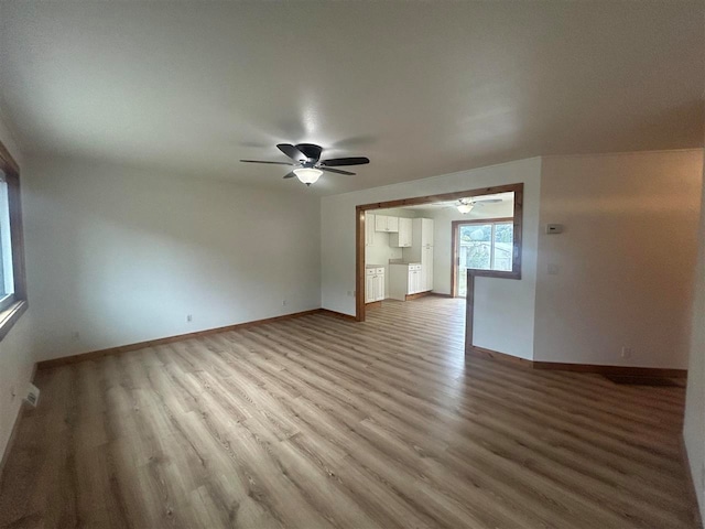 spare room with ceiling fan and light hardwood / wood-style floors