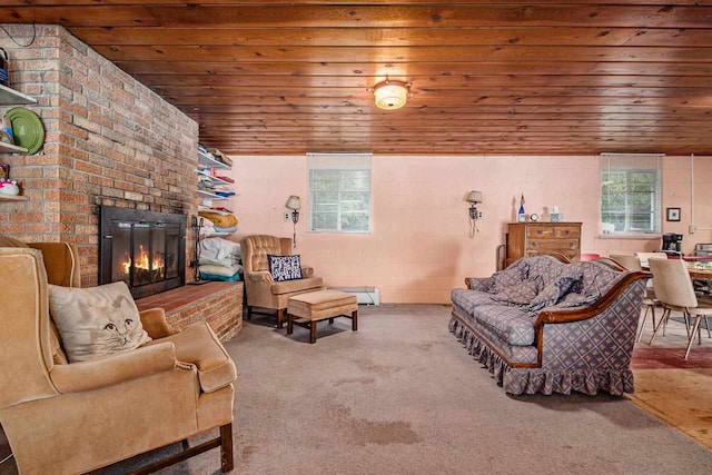 living room featuring carpet, wooden ceiling, and a fireplace